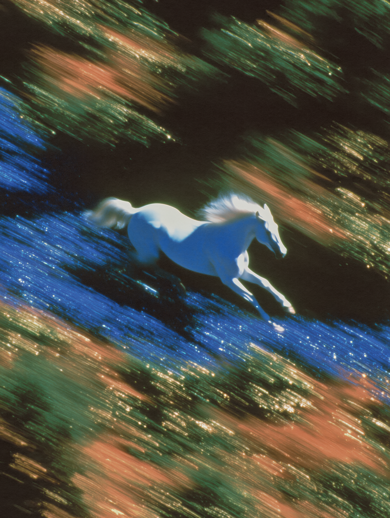 A white horse galloping through streaks of light